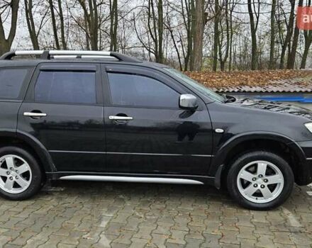 Черный Мицубиси Аутлендер, объемом двигателя 2.4 л и пробегом 167 тыс. км за 6150 $, фото 7 на Automoto.ua