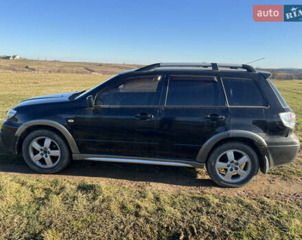 Черный Мицубиси Аутлендер, объемом двигателя 2.38 л и пробегом 230 тыс. км за 5350 $, фото 6 на Automoto.ua
