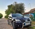 Черный Мицубиси Аутлендер, объемом двигателя 2 л и пробегом 170 тыс. км за 9000 $, фото 2 на Automoto.ua