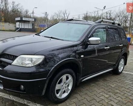 Черный Мицубиси Аутлендер, объемом двигателя 2.4 л и пробегом 167 тыс. км за 6150 $, фото 4 на Automoto.ua