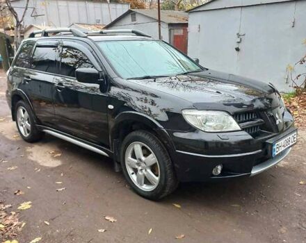 Черный Мицубиси Аутлендер, объемом двигателя 2.4 л и пробегом 256 тыс. км за 6900 $, фото 2 на Automoto.ua