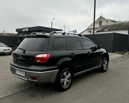 Чорний Міцубісі Аутлендер, об'ємом двигуна 2 л та пробігом 297 тис. км за 6200 $, фото 8 на Automoto.ua