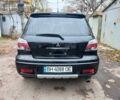 Черный Мицубиси Аутлендер, объемом двигателя 2.4 л и пробегом 256 тыс. км за 6900 $, фото 4 на Automoto.ua