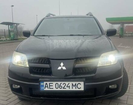 Черный Мицубиси Аутлендер, объемом двигателя 2.4 л и пробегом 277 тыс. км за 6700 $, фото 1 на Automoto.ua