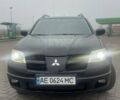 Черный Мицубиси Аутлендер, объемом двигателя 2.4 л и пробегом 277 тыс. км за 6700 $, фото 1 на Automoto.ua
