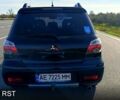 Черный Мицубиси Аутлендер, объемом двигателя 2.4 л и пробегом 265 тыс. км за 7500 $, фото 1 на Automoto.ua
