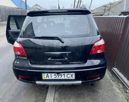 Черный Мицубиси Аутлендер, объемом двигателя 2.4 л и пробегом 234 тыс. км за 5499 $, фото 3 на Automoto.ua