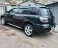 Черный Мицубиси Аутлендер, объемом двигателя 2.4 л и пробегом 256 тыс. км за 6900 $, фото 3 на Automoto.ua