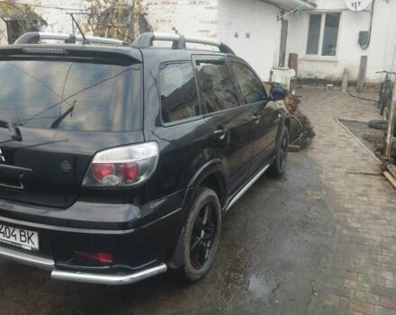 Черный Мицубиси Аутлендер, объемом двигателя 2.4 л и пробегом 280 тыс. км за 5455 $, фото 4 на Automoto.ua