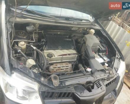 Черный Мицубиси Аутлендер, объемом двигателя 2.4 л и пробегом 280 тыс. км за 5455 $, фото 11 на Automoto.ua