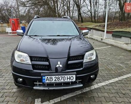 Черный Мицубиси Аутлендер, объемом двигателя 2.4 л и пробегом 167 тыс. км за 6150 $, фото 6 на Automoto.ua