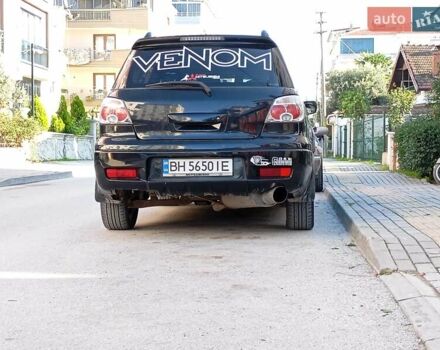 Черный Мицубиси Аутлендер, объемом двигателя 2 л и пробегом 216 тыс. км за 5600 $, фото 2 на Automoto.ua