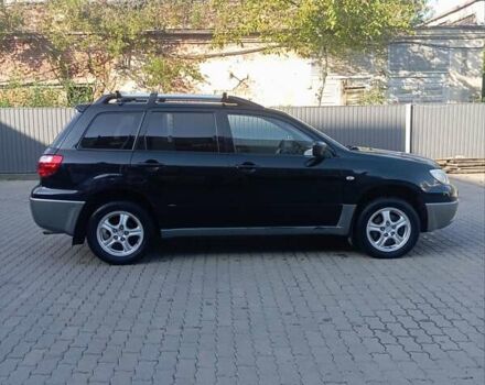 Черный Мицубиси Аутлендер, объемом двигателя 2 л и пробегом 297 тыс. км за 4550 $, фото 4 на Automoto.ua