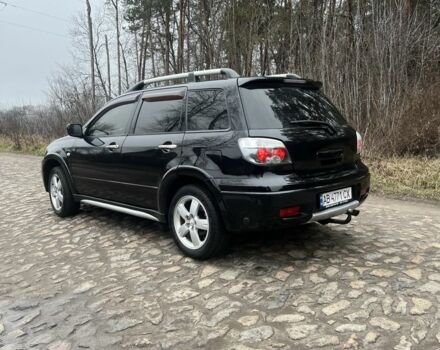 Черный Мицубиси Аутлендер, объемом двигателя 2.4 л и пробегом 310 тыс. км за 5300 $, фото 2 на Automoto.ua