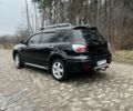 Черный Мицубиси Аутлендер, объемом двигателя 2.4 л и пробегом 310 тыс. км за 5300 $, фото 2 на Automoto.ua