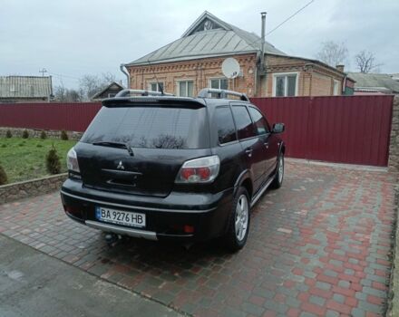 Черный Мицубиси Аутлендер, объемом двигателя 2 л и пробегом 200 тыс. км за 5100 $, фото 3 на Automoto.ua