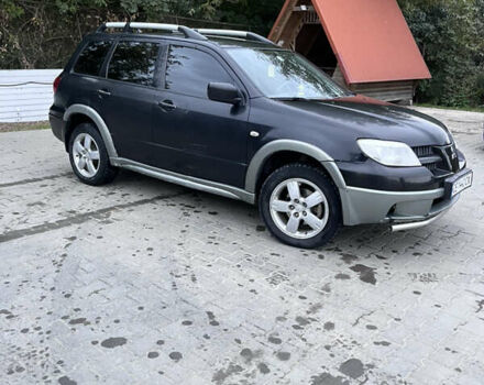 Черный Мицубиси Аутлендер, объемом двигателя 2 л и пробегом 280 тыс. км за 4999 $, фото 7 на Automoto.ua