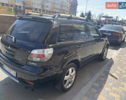 Черный Мицубиси Аутлендер, объемом двигателя 2 л и пробегом 212 тыс. км за 6000 $, фото 2 на Automoto.ua