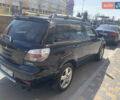 Черный Мицубиси Аутлендер, объемом двигателя 2 л и пробегом 212 тыс. км за 6000 $, фото 2 на Automoto.ua