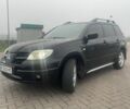 Чорний Міцубісі Аутлендер, об'ємом двигуна 2.4 л та пробігом 277 тис. км за 6700 $, фото 1 на Automoto.ua