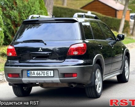 Черный Мицубиси Аутлендер, объемом двигателя 2.4 л и пробегом 263 тыс. км за 5999 $, фото 5 на Automoto.ua