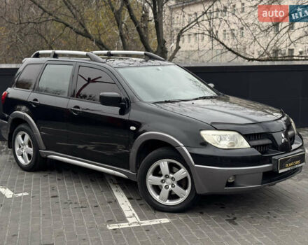 Черный Мицубиси Аутлендер, объемом двигателя 2.4 л и пробегом 242 тыс. км за 6800 $, фото 5 на Automoto.ua