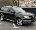 Черный Мицубиси Аутлендер, объемом двигателя 2.4 л и пробегом 242 тыс. км за 6800 $, фото 5 на Automoto.ua