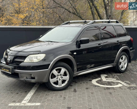 Черный Мицубиси Аутлендер, объемом двигателя 2.4 л и пробегом 242 тыс. км за 6800 $, фото 2 на Automoto.ua