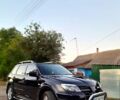 Черный Мицубиси Аутлендер, объемом двигателя 2 л и пробегом 170 тыс. км за 9000 $, фото 1 на Automoto.ua