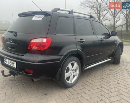 Черный Мицубиси Аутлендер, объемом двигателя 2.4 л и пробегом 277 тыс. км за 6700 $, фото 3 на Automoto.ua
