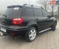 Черный Мицубиси Аутлендер, объемом двигателя 2.4 л и пробегом 277 тыс. км за 6700 $, фото 3 на Automoto.ua