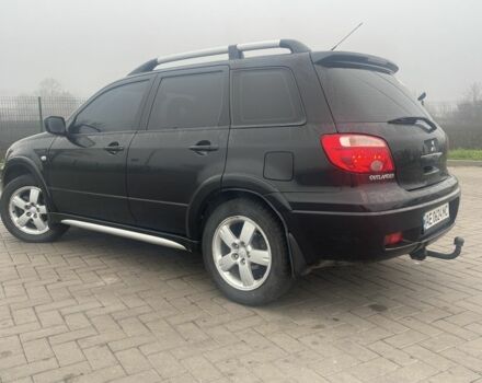 Чорний Міцубісі Аутлендер, об'ємом двигуна 2.4 л та пробігом 277 тис. км за 6700 $, фото 3 на Automoto.ua