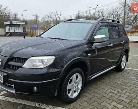 Черный Мицубиси Аутлендер, объемом двигателя 2.4 л и пробегом 167 тыс. км за 6150 $, фото 3 на Automoto.ua
