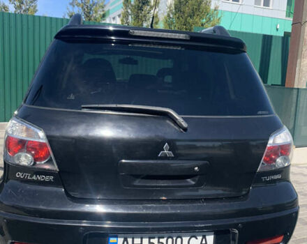 Черный Мицубиси Аутлендер, объемом двигателя 2 л и пробегом 212 тыс. км за 6000 $, фото 23 на Automoto.ua
