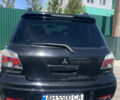 Черный Мицубиси Аутлендер, объемом двигателя 2 л и пробегом 212 тыс. км за 6000 $, фото 23 на Automoto.ua