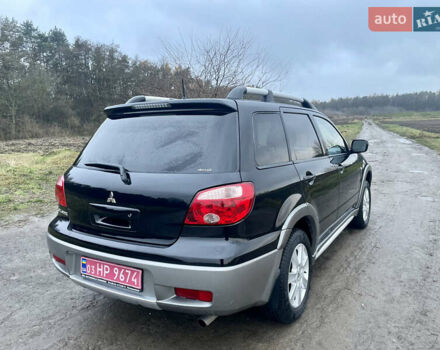 Черный Мицубиси Аутлендер, объемом двигателя 2 л и пробегом 130 тыс. км за 6999 $, фото 7 на Automoto.ua