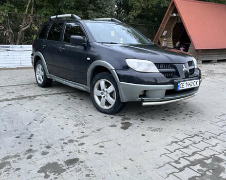 Черный Мицубиси Аутлендер, объемом двигателя 2 л и пробегом 280 тыс. км за 4999 $, фото 6 на Automoto.ua