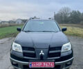 Черный Мицубиси Аутлендер, объемом двигателя 2 л и пробегом 130 тыс. км за 6999 $, фото 1 на Automoto.ua