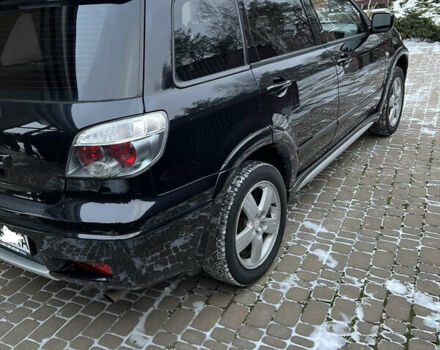Чорний Міцубісі Аутлендер, об'ємом двигуна 2.4 л та пробігом 165 тис. км за 6800 $, фото 1 на Automoto.ua