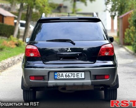 Черный Мицубиси Аутлендер, объемом двигателя 2.4 л и пробегом 263 тыс. км за 5999 $, фото 4 на Automoto.ua