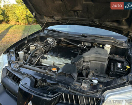 Мицубиси Аутлендер 2006 в Чернобае на Automoto.ua Черный Мицубиси Аутлендер, объемом двигателя 2.38 л и пробегом 278 тыс. км за 5300 $, фото 9 на Automoto.ua