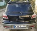 Черный Мицубиси Аутлендер, объемом двигателя 2 л и пробегом 225 тыс. км за 7000 $, фото 2 на Automoto.ua