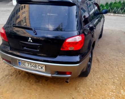 Черный Мицубиси Аутлендер, объемом двигателя 2 л и пробегом 226 тыс. км за 7000 $, фото 3 на Automoto.ua