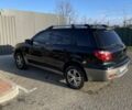 Черный Мицубиси Аутлендер, объемом двигателя 2 л и пробегом 297 тыс. км за 6500 $, фото 1 на Automoto.ua