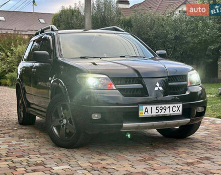 Чорний Міцубісі Аутлендер, об'ємом двигуна 2.38 л та пробігом 247 тис. км за 5499 $, фото 38 на Automoto.ua