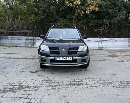 Черный Мицубиси Аутлендер, объемом двигателя 2 л и пробегом 280 тыс. км за 4999 $, фото 4 на Automoto.ua
