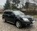 Черный Мицубиси Аутлендер, объемом двигателя 2.4 л и пробегом 310 тыс. км за 5300 $, фото 5 на Automoto.ua