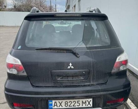 Черный Мицубиси Аутлендер, объемом двигателя 2.38 л и пробегом 260 тыс. км за 5000 $, фото 6 на Automoto.ua