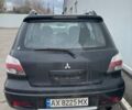 Черный Мицубиси Аутлендер, объемом двигателя 2.38 л и пробегом 260 тыс. км за 5000 $, фото 6 на Automoto.ua