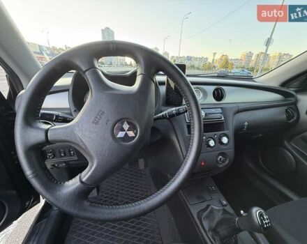 Черный Мицубиси Аутлендер, объемом двигателя 2 л и пробегом 158 тыс. км за 6700 $, фото 26 на Automoto.ua